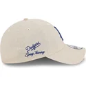 gorra-curva-beige-ajustable-con-logo-azul-9twenty-linen-spring-training-fan-pack-2025-de-los-angeles-dodgers-mlb-de-new-era